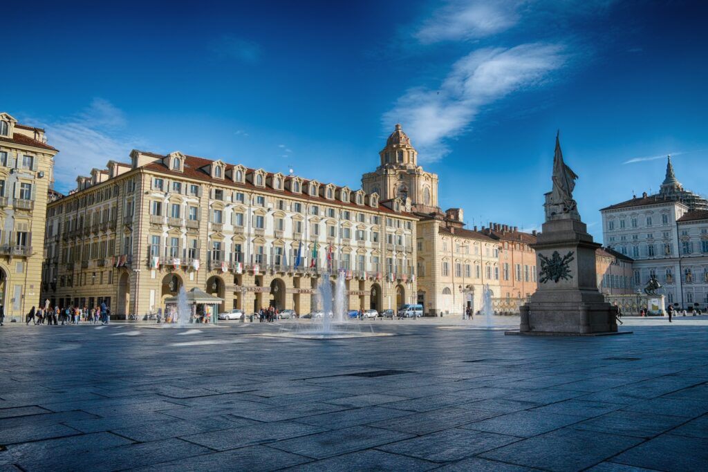 beige concrete palace with statue in front under blue sky at daytime,Top-Rated Tourist Attractions & Things to Do in Turin