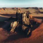 Top places to visit in the world, an aerial view of a desert with rocks and sand