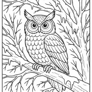 Owl perched on frozen tree branch