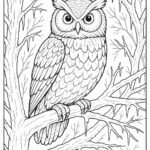 Owl perched on frozen tree branch